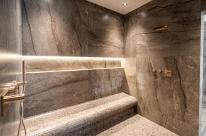 Walk in shower and curved seating mosaic